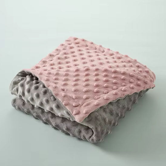 Couverture bébé rose et grise au design élégant